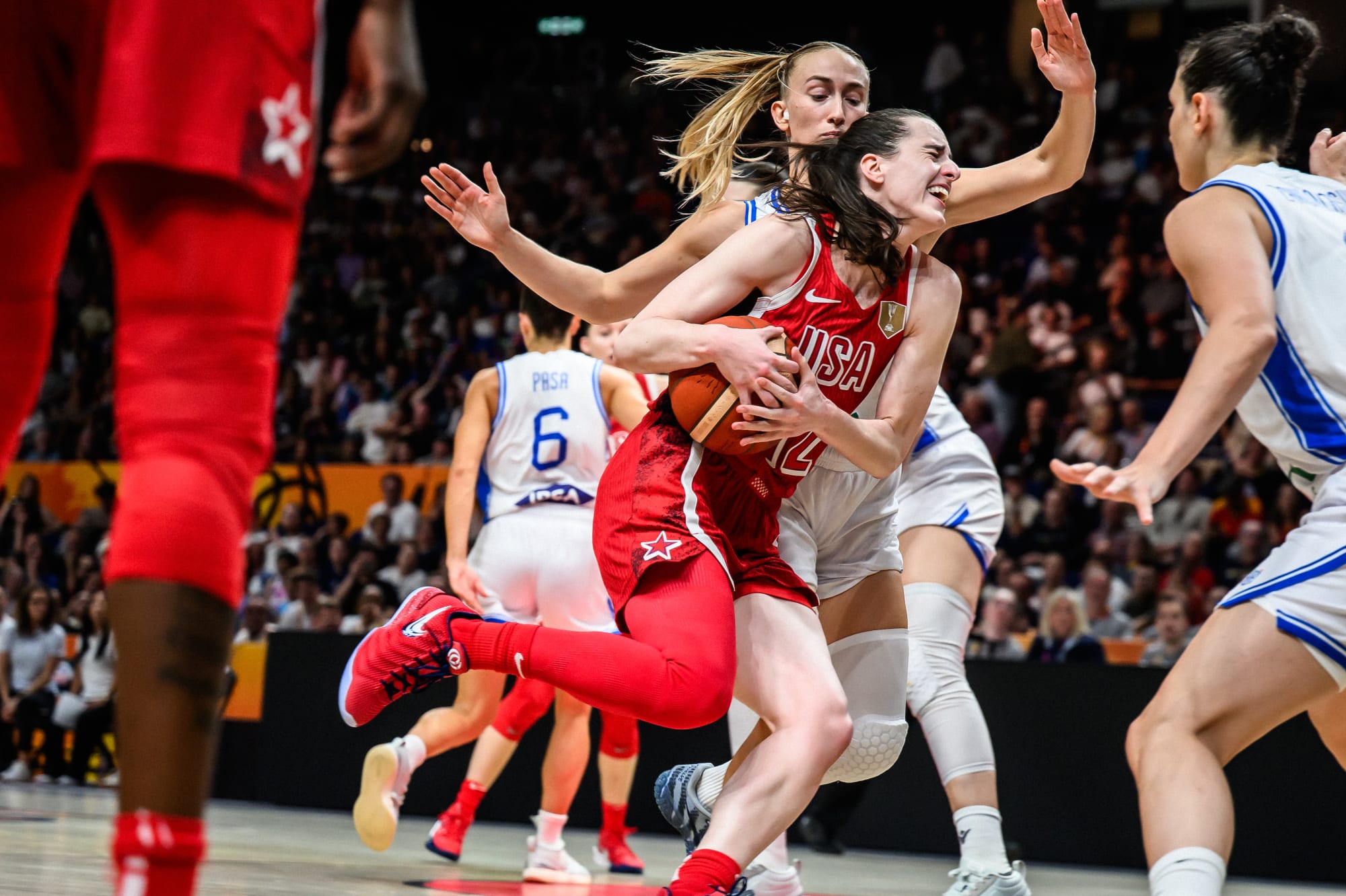 Team USA driving against Italy in official FIBA action